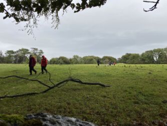 Walking past the burial mound towards the view of Leighton Hall